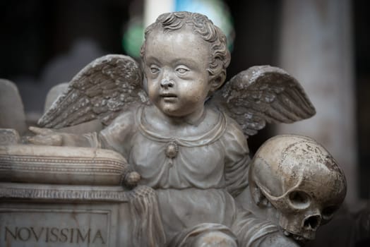 White statue of angel boy in church. Sweden, Scandinavia. Europe travel.