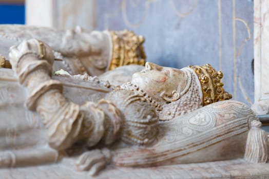 Laying statues inside tomb of old church in Sweden, Scandinavia, Europe. King and queen.