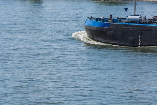 Bow of a large merchant ship,container ship on a large river.     .