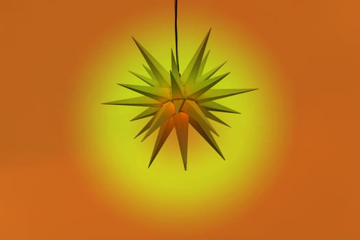 Illuminated poinsettia against a gradient background..