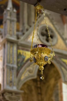 Detail of a Christian gold candle.