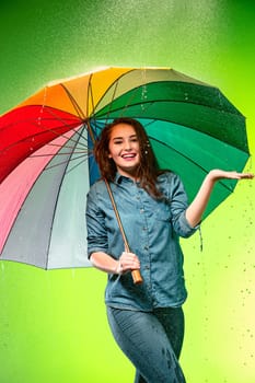 Young beautiful woman with an umbrella. Studio shot