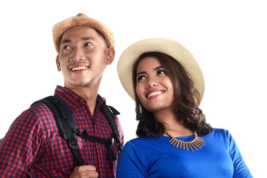 Asian tourist couple smiling isolated over white background