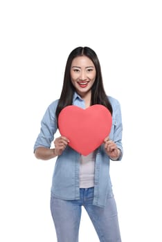 Valentine day concept. Beautiful asian girl holding red heart