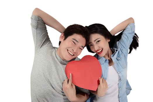 Valentine couple concept. Portrait of man and woman holding red heart