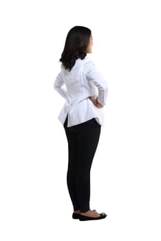 Back view of a female doctor looking at white. Full length shot