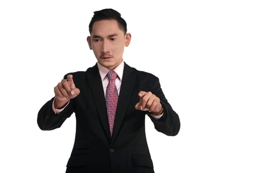 Asian business man pointing something isolated over white background