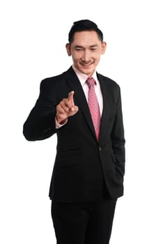 Asian business man pointing something isolated over white background