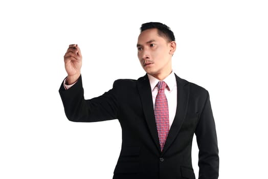 Asian business man writing something with pen isolated over white background