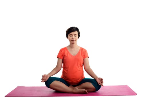 Asian pregnant woman doing yoga over isolated white background