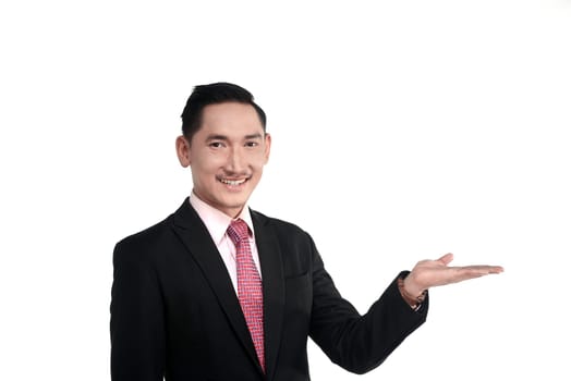 Asian business man show something isolated over white background