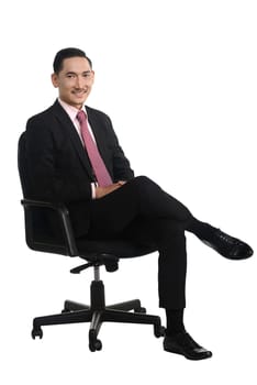 Business man sitting on the chair isolated over white background