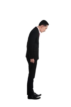 Asian business man looking down isolated over white background
