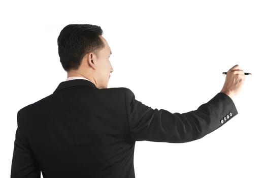 Asian business man writing something with pen isolated over white background