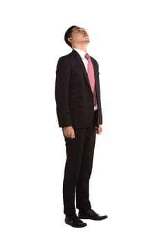 Asian man looking up isolated over white background