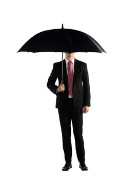 Business man standing holding umbrella isolated over white background