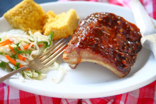Barbecued baby back ribs with coleslaw and cornbread