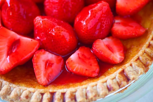 Glazed fresh strawberries over a custard pie