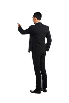 Asian business man pointing something isolated over white background