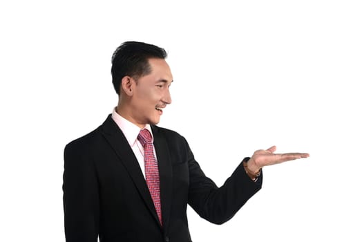 Asian business man show something isolated over white background