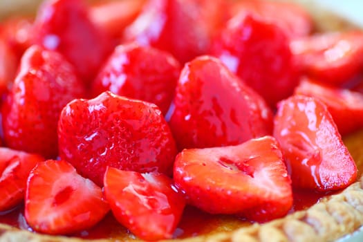 Glazed fresh strawberries on a custard pie closeup
