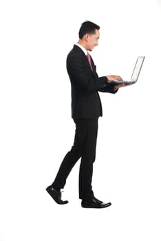 Business man standing working with laptop isolated over white background