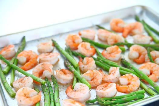 Shrimp and asparagus cook in the oven for a healthy dinner