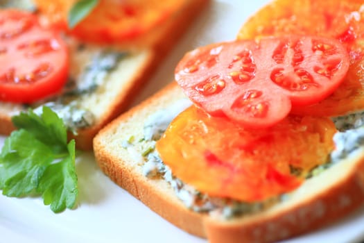 Sandwich made of heirloom tomatoes with cilantro mayonnaise on white bread