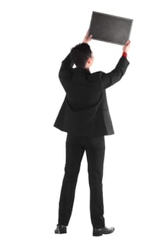 Young business man holding chalk board isolated over white background