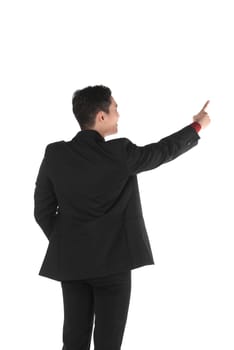 Asian business man pointing something isolated over white background
