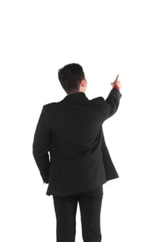 Asian business man pointing something isolated over white background