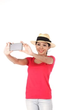 Asian woman doing selfie isolated over white background