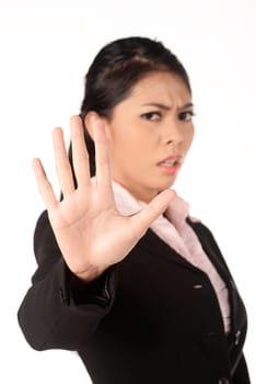 Asian business woman gesturing stop isolated over white background