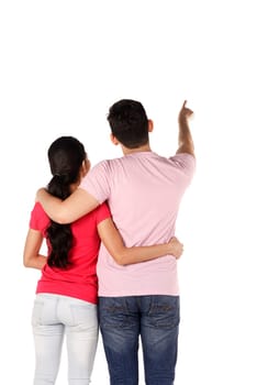 Young asian couple pointing something isolated over white background