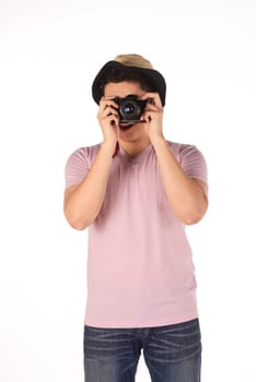 Asian photographer taking image isolated over white background