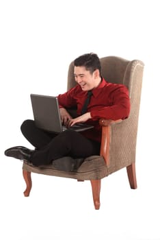 Business man working on a laptop isolated over white background