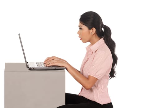 Business woman working on laptop isolated over white background