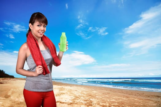 Asian woman doing exercise on the beach