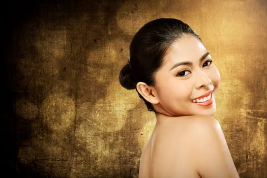 Beautiful asian woman in studio with abstract blur background
