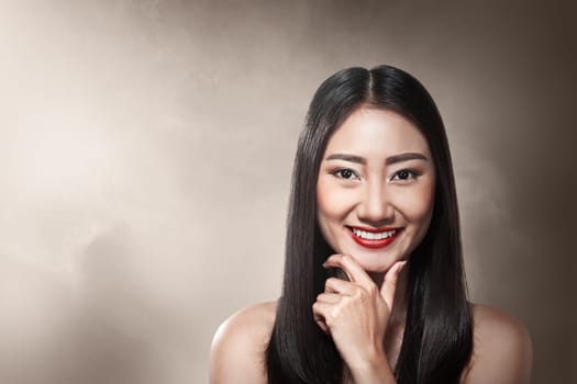 Beautiful asian woman over blur background