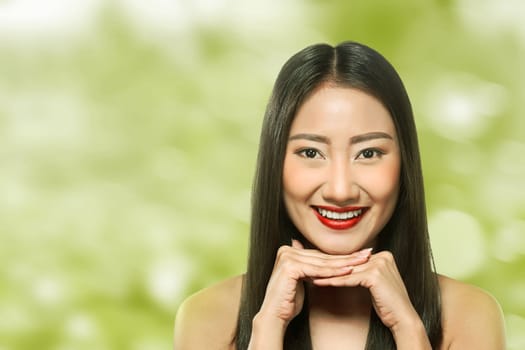Beautiful asian woman over blur background