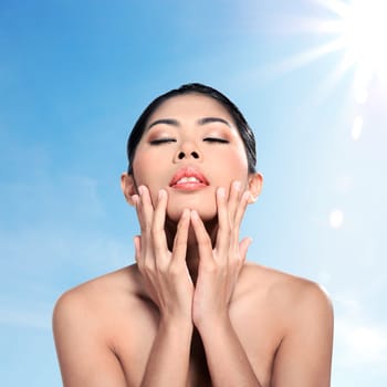 Beautiful asian woman in studio with abstract blur background