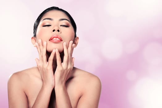 Beautiful asian woman in studio with abstract blur background