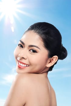 Beautiful asian woman in studio with abstract blur background