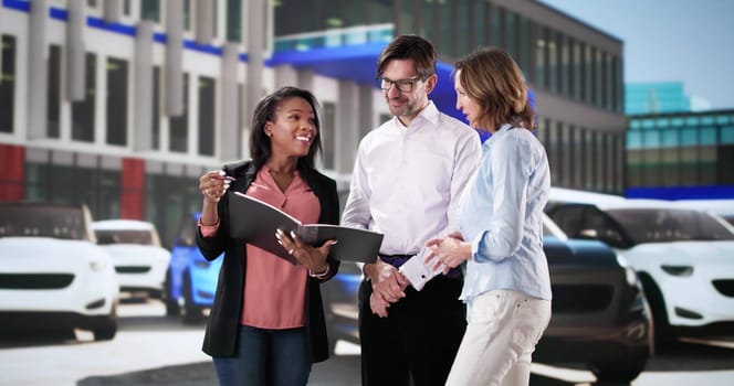 Customers choosing new car with dealer at dealership showroom.  Family discussing terms with finance manager for contract signing.