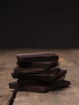 Pile of chocolate on a rustic wooden table