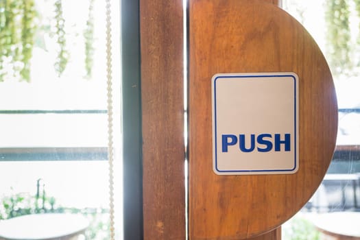 Push sign on door coffee shop, stock photo