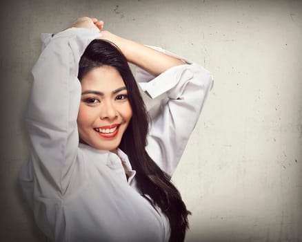 Beautiful face of young adult woman with clean fresh skin over blur background