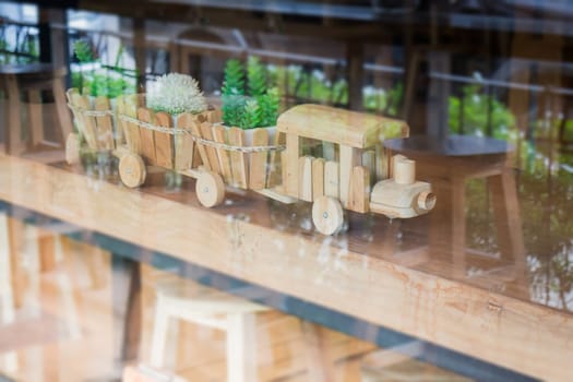 Wooden toy decorated on table, stock photo