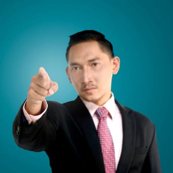 Asian business man pointing something with confident look